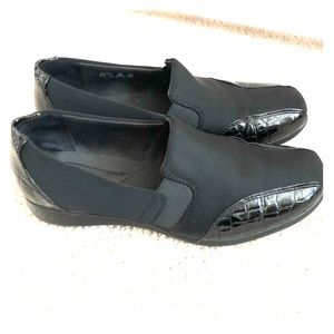 Clark’s black slip on shoes. Cute and comfy!